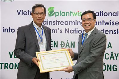 Siva and Wai Hong colled the MARD medal from Vietnam's Ministry of Agriculture and Rural Development