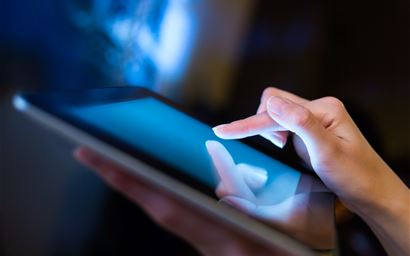 hand presses on screen digital tablet