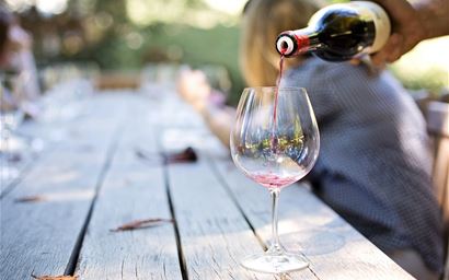 wine being poured into a glass