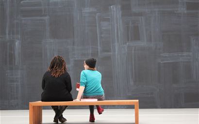 Visitors to exhibition in art gallery