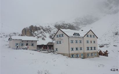 Mountain hotel in the snow in the Dolomites