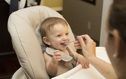 baby being introduced to weaned foods