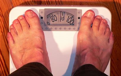 two feet on bathroom scales.