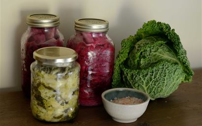 jars of pickled cabbage plus a cabbage and salt.