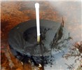 'Snail Busters' apple snail trap 'Snail Busters' apple snail trap as deployed in shallow water
