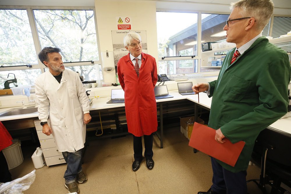 Egham, Surrey, United Kingdom. Andrew Mitchell MP, Minister of State for International Development and Africa, talks to scientists at CABI who are working to improve people’s lives worldwide by providing information and applying expertise to solve problems in agriculture and the environment. Credit: FCDO/Russell Watkins