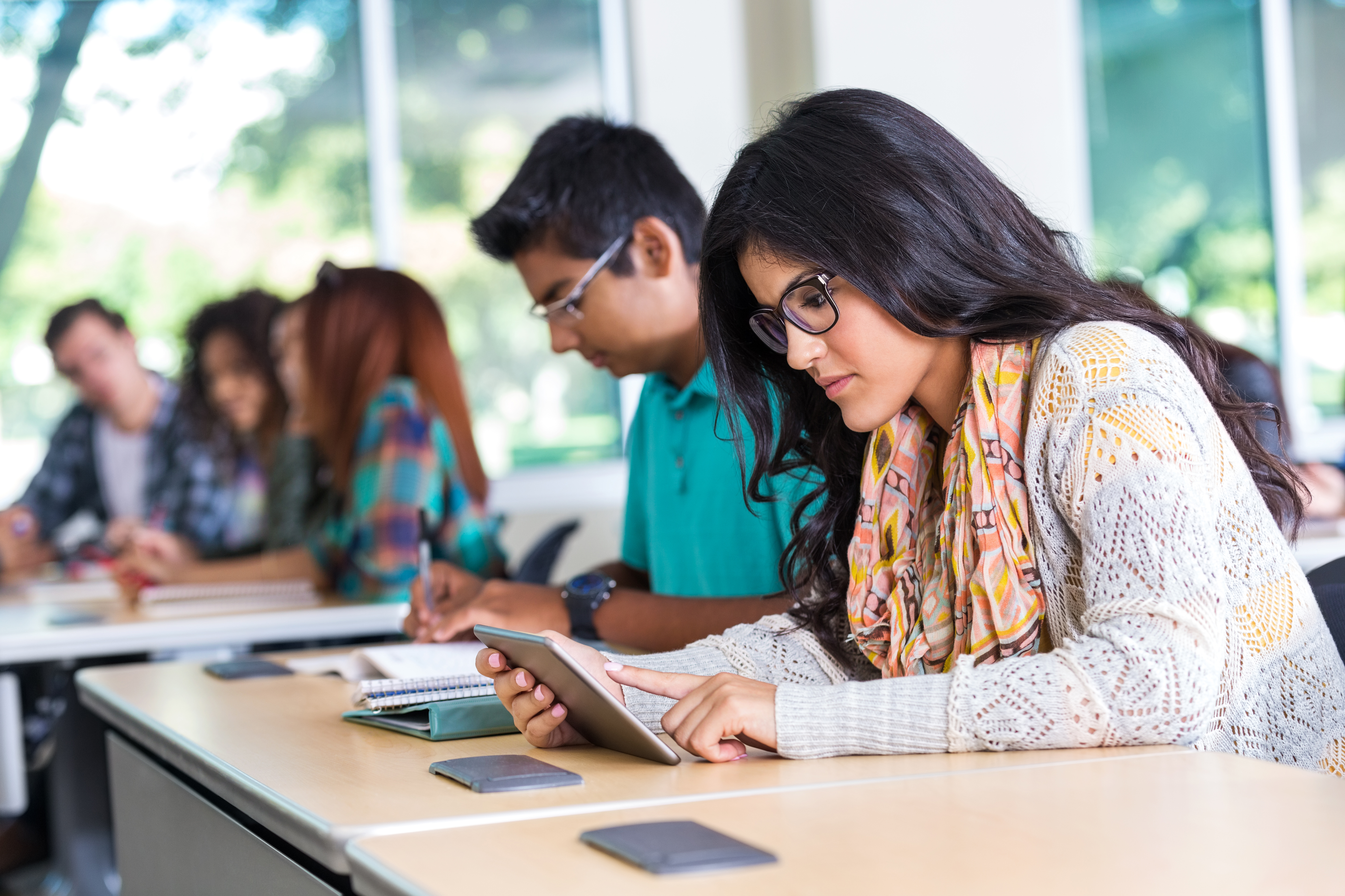 Female student looking at tablets