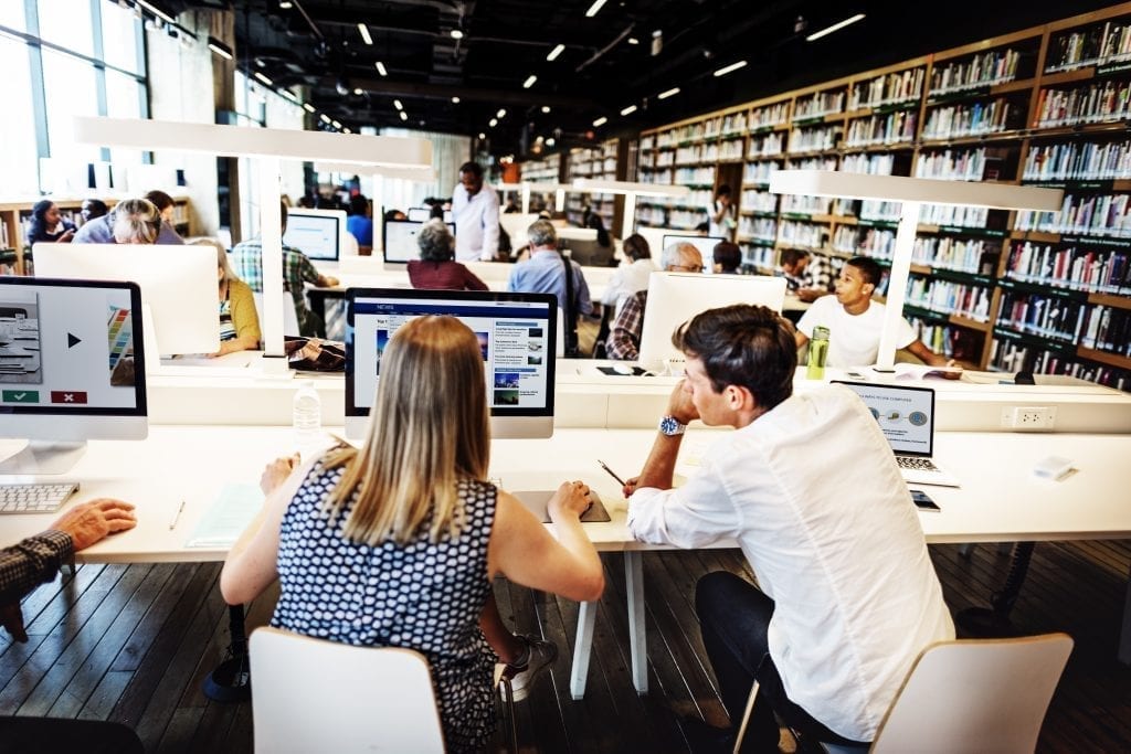People in library using computers
