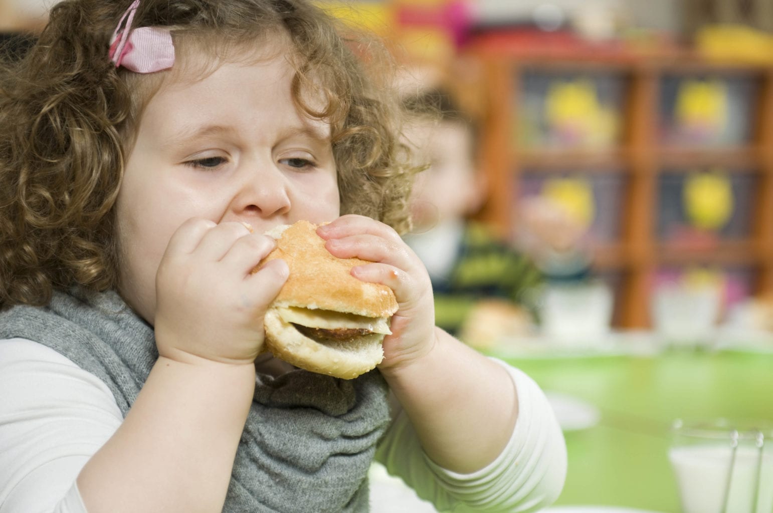 child eating a burger