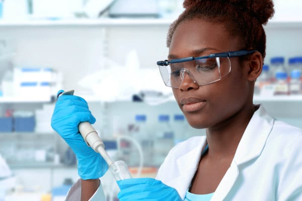 Young woman in lab coat 600x400
