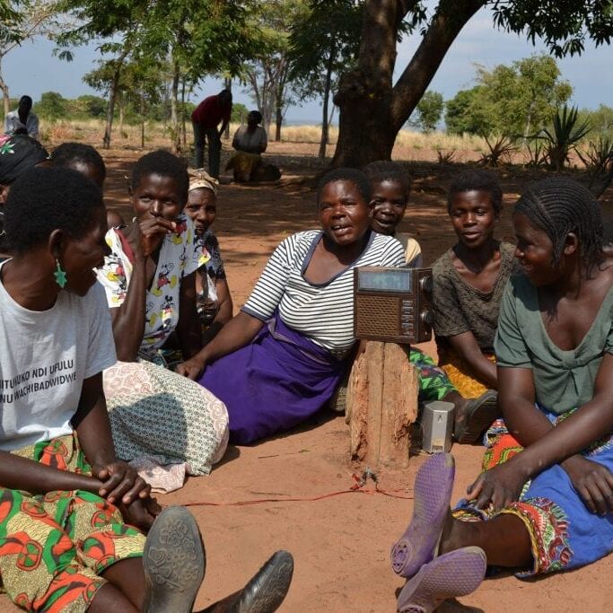 Village listening to radio