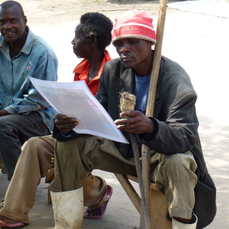 Farmer reading poster