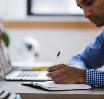 man working at a laptop